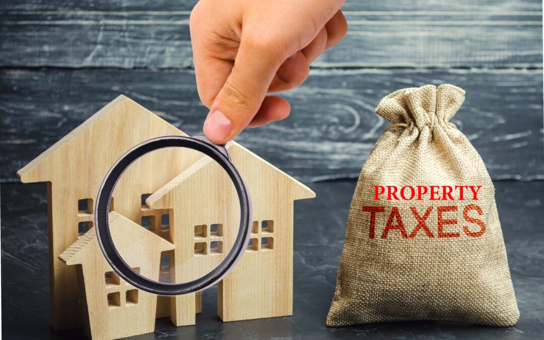 A hand holding a magnifying glass examining a sack labeled 'Property Taxes