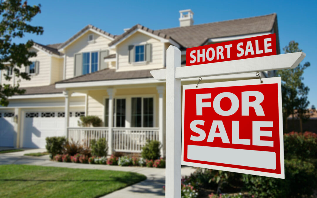 Short Sale sign in front of a house